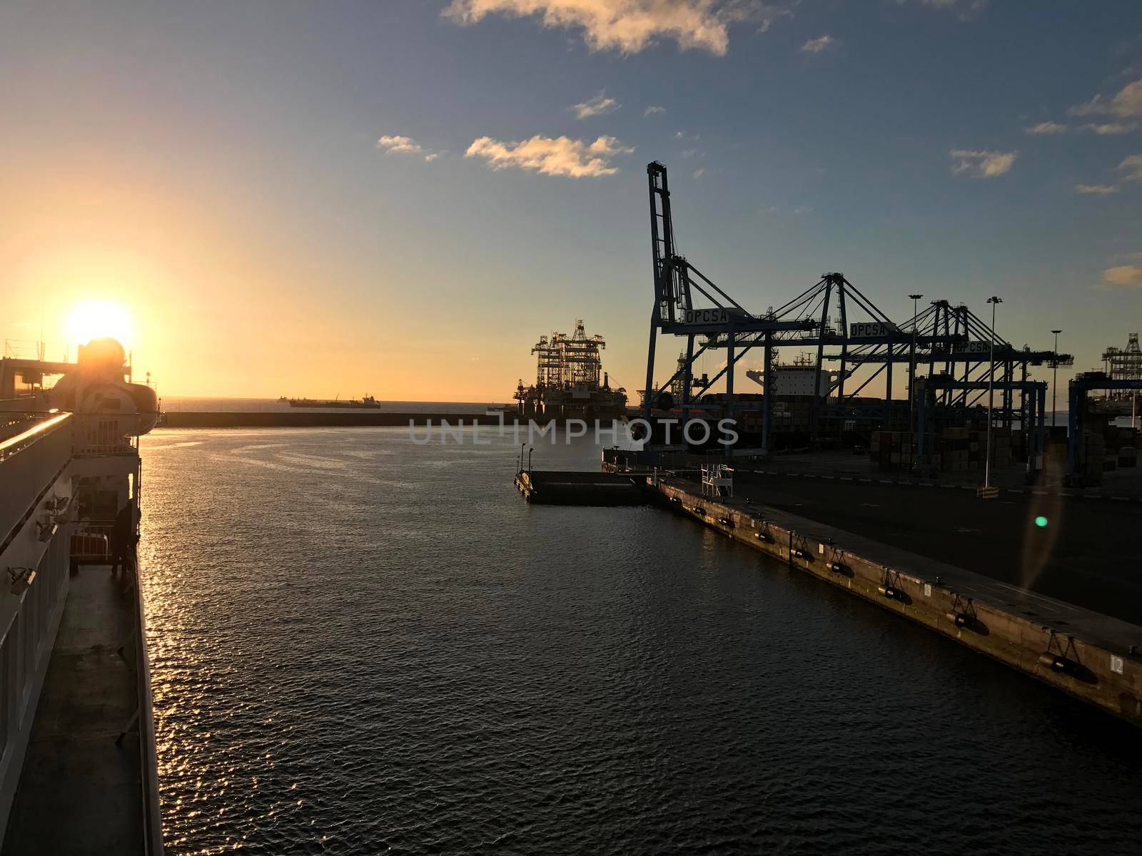 Ferry leaving Las Palmas harbour in Gran Canaria during sunrise