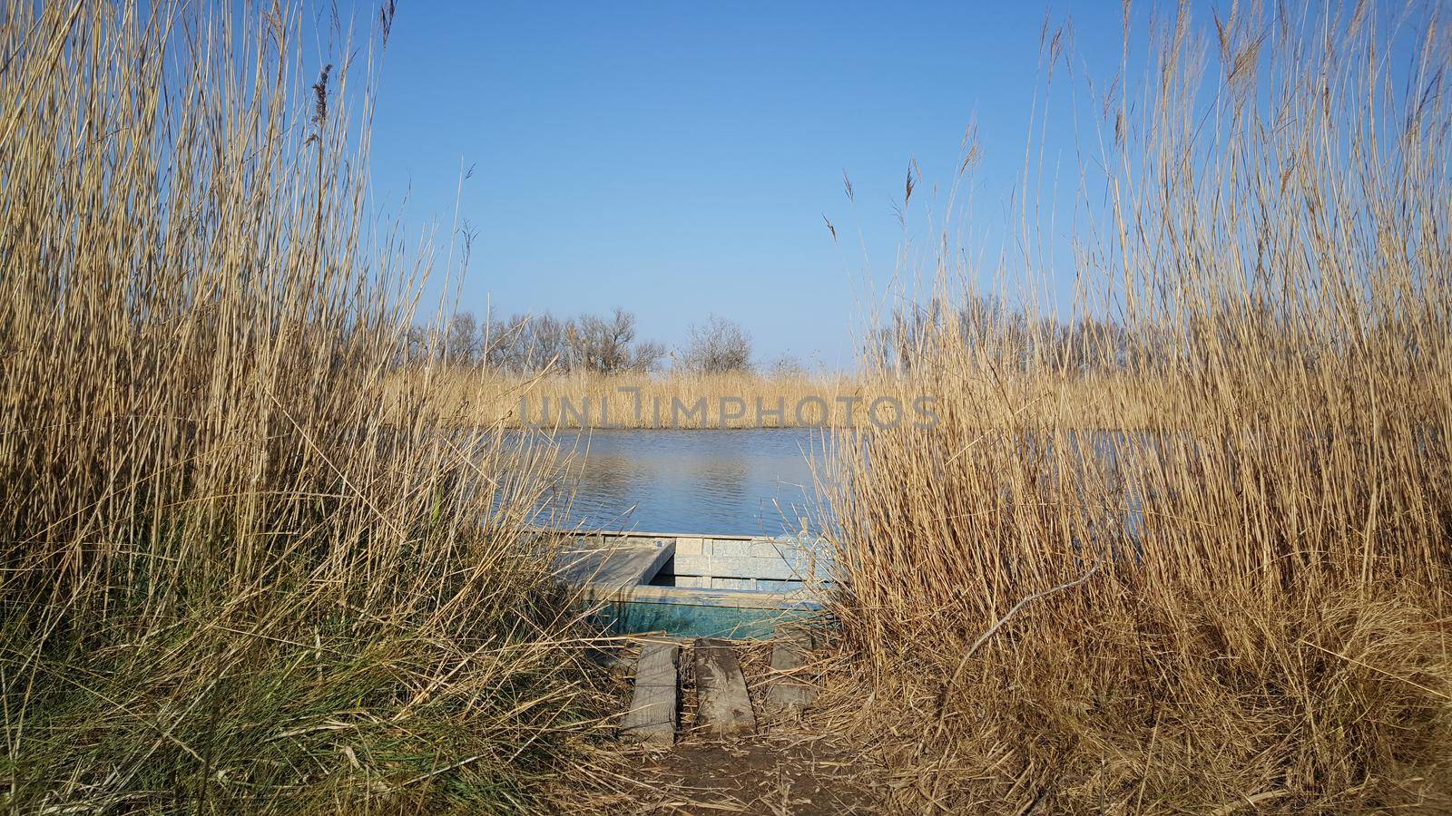 River with a boat in the Parc Natural del Delta de l'Ebre Spain