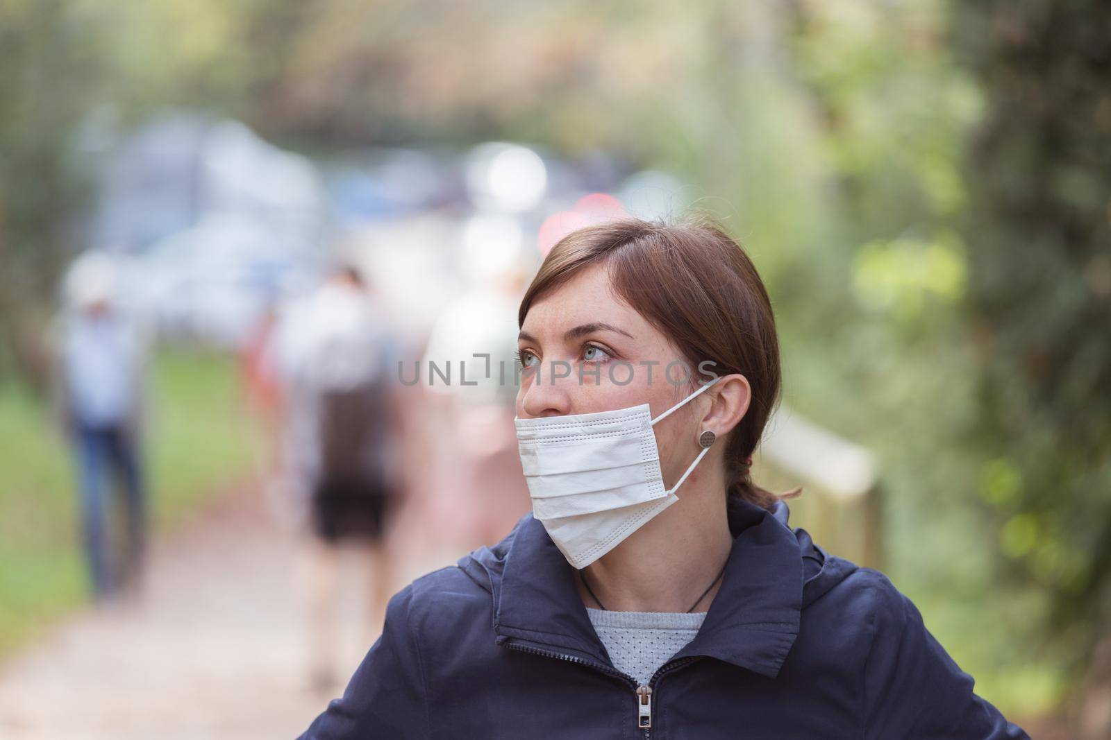 Young woman is wearing face mask wrong, nose uncovered
