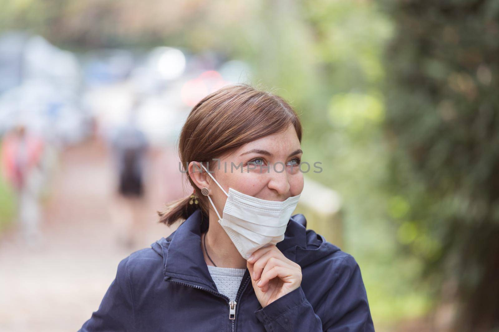 Young woman is wearing face mask wrong, nose uncovered