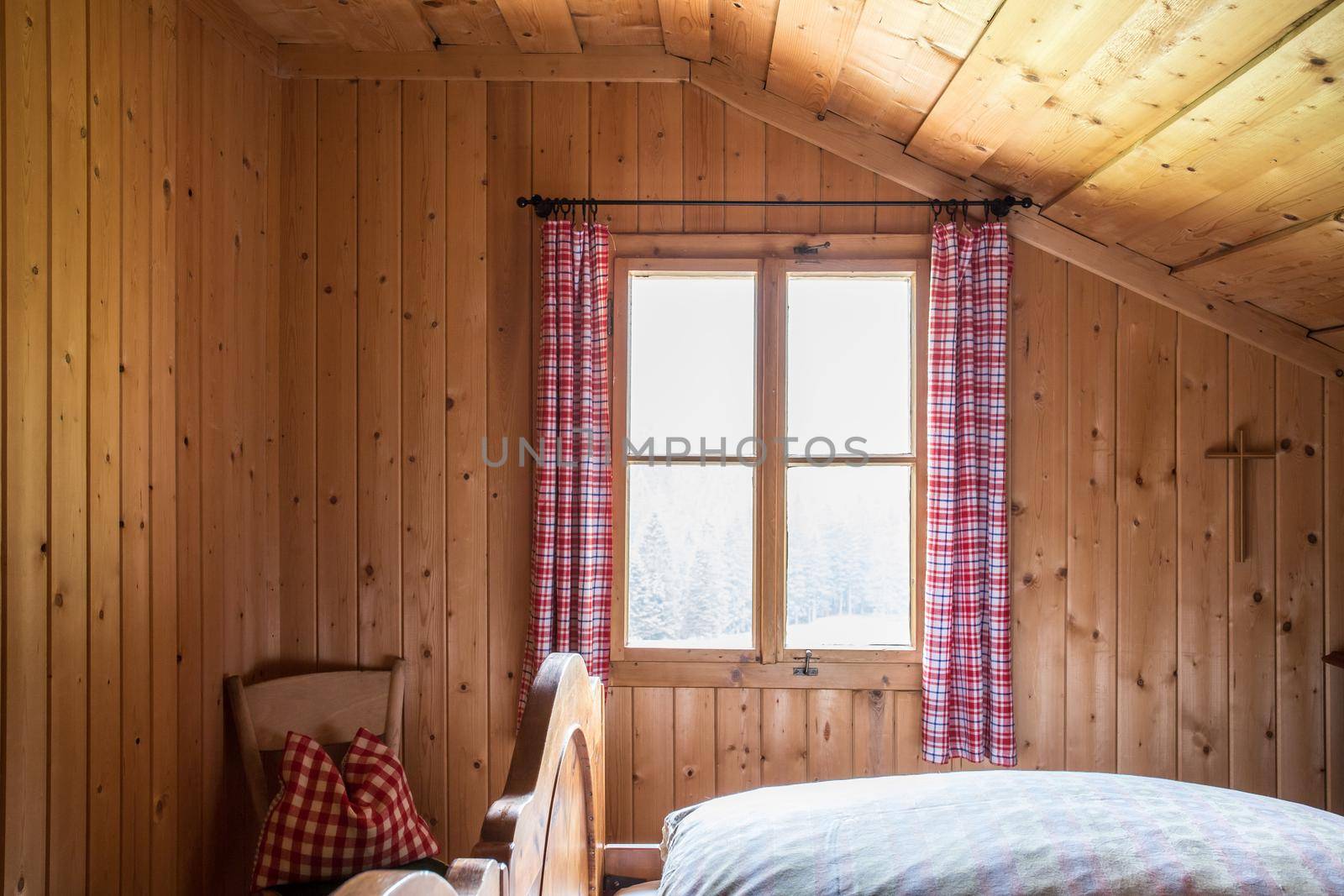Holiday in the mountains: Rustic old wooden interior of a cabin or alpine hut by Daxenbichler