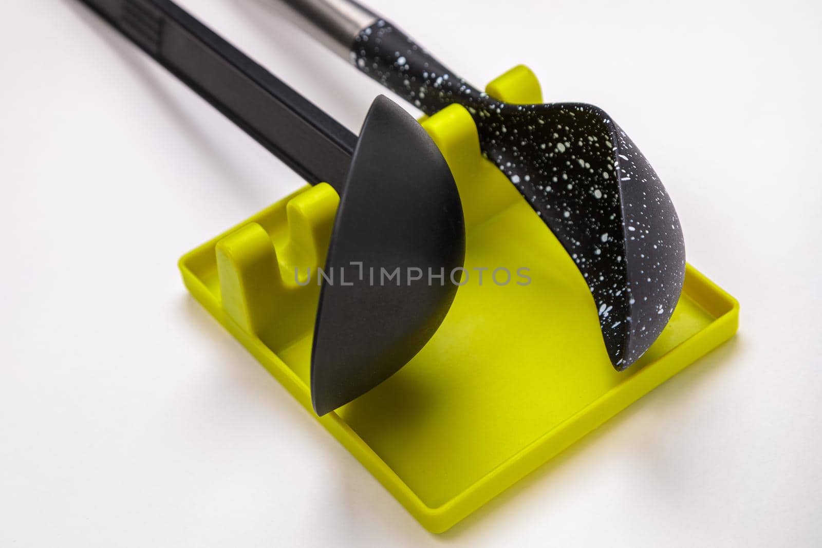 Stand, tray for large spoons, ladles, stirrers. Modern fittings in the kitchen. Convenient to prepare food.