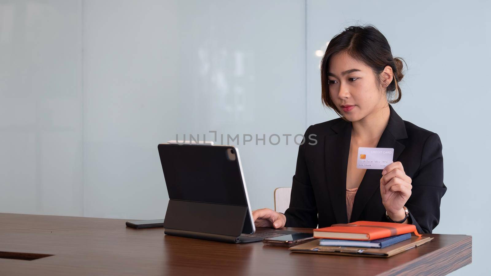 Busiesswoman holding creditcard and using laptop computer for online shopping, Online Payment, e-commerce, internet banking