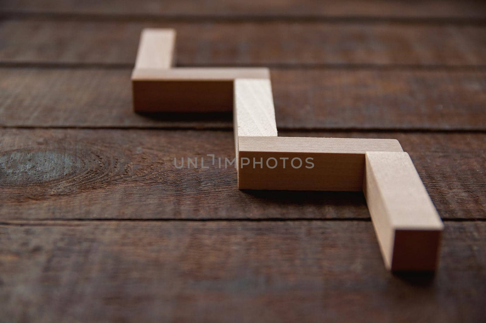 background wooden brown there are laid out wooden rectangles, arranged in a certain order in the style of minimalism