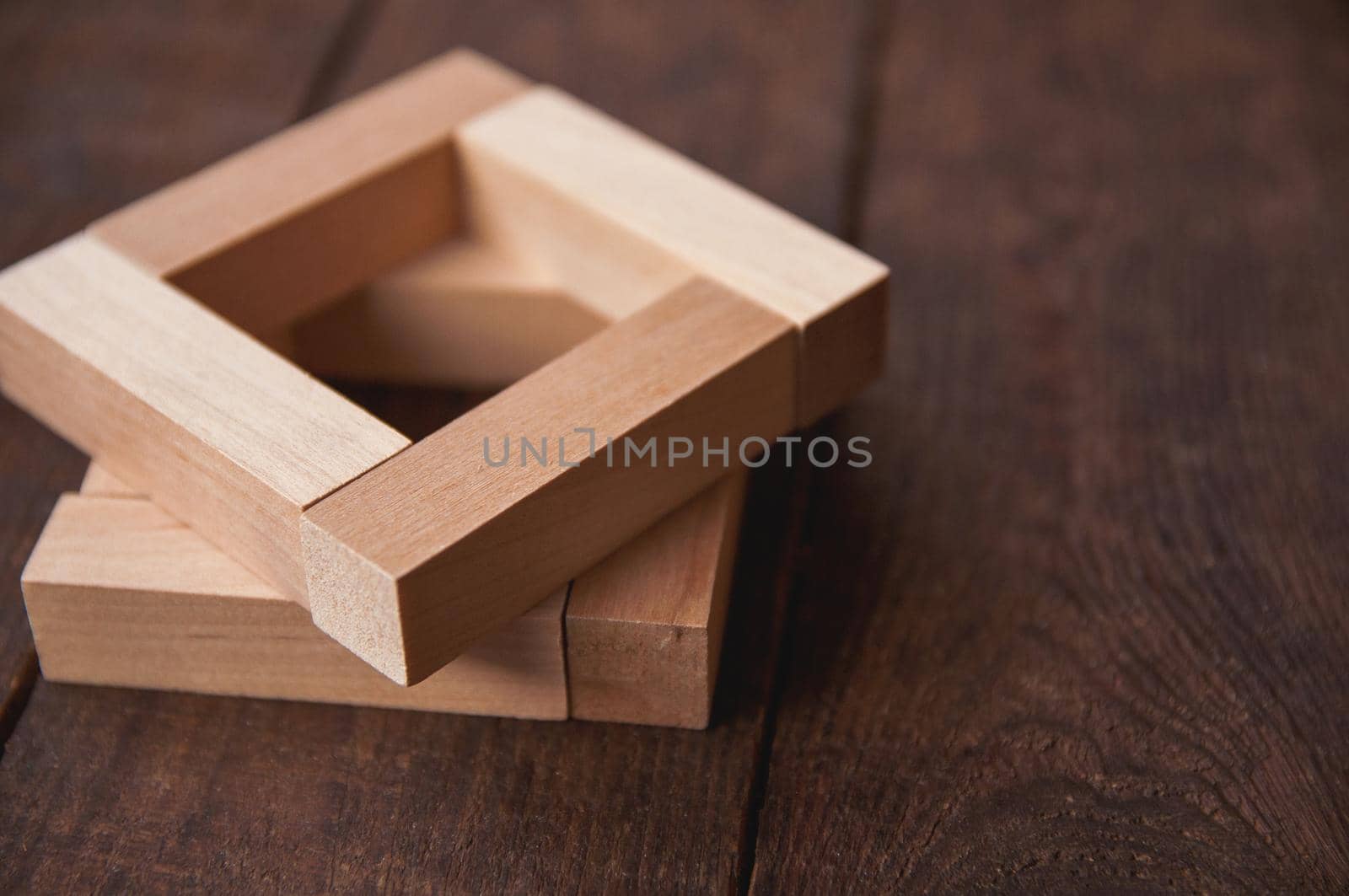 background wooden brown there are laid out wooden rectangles, arranged in a certain order in the style of minimalism