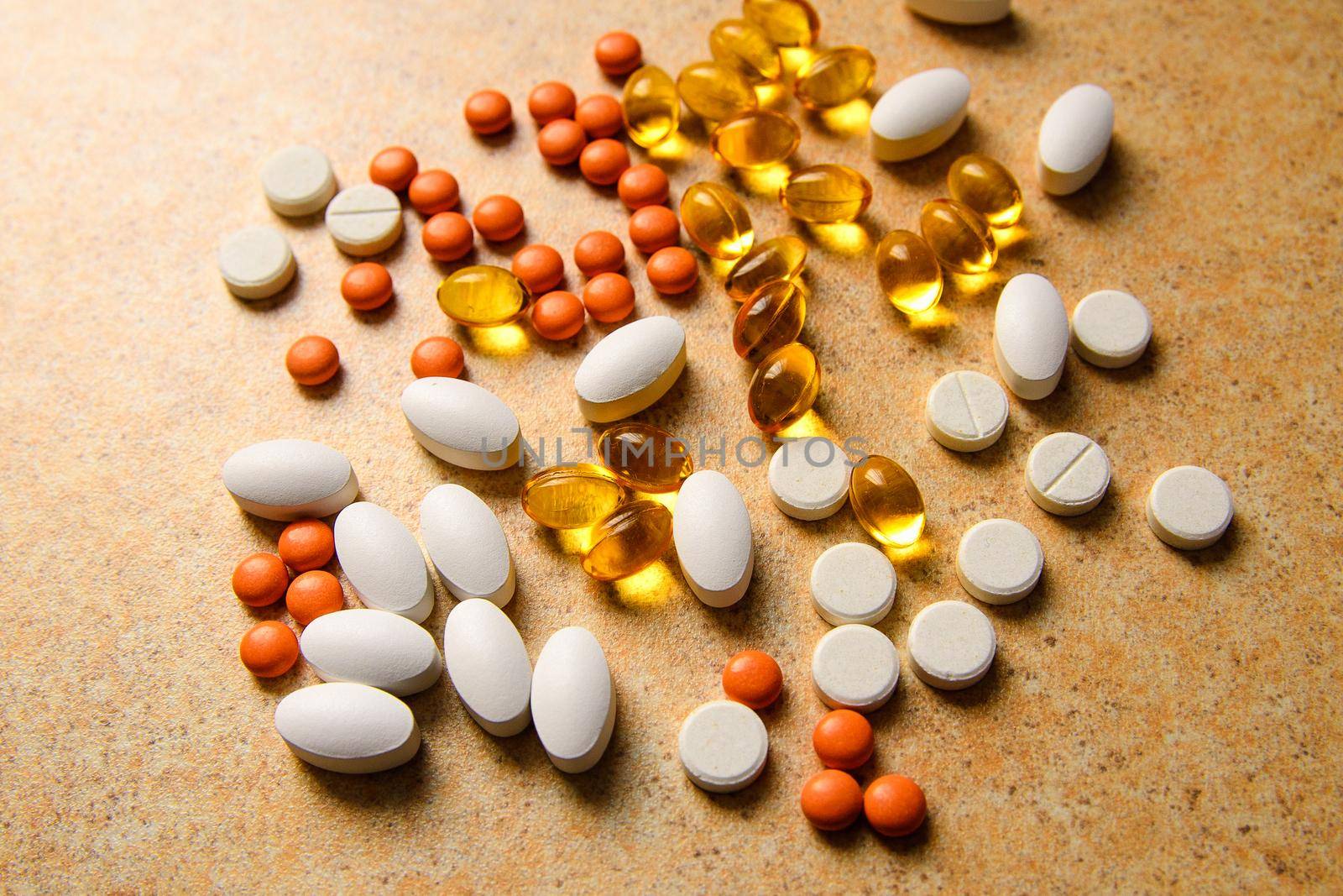 orange pills, vitamin D and fish oil capsules  by ozornina
