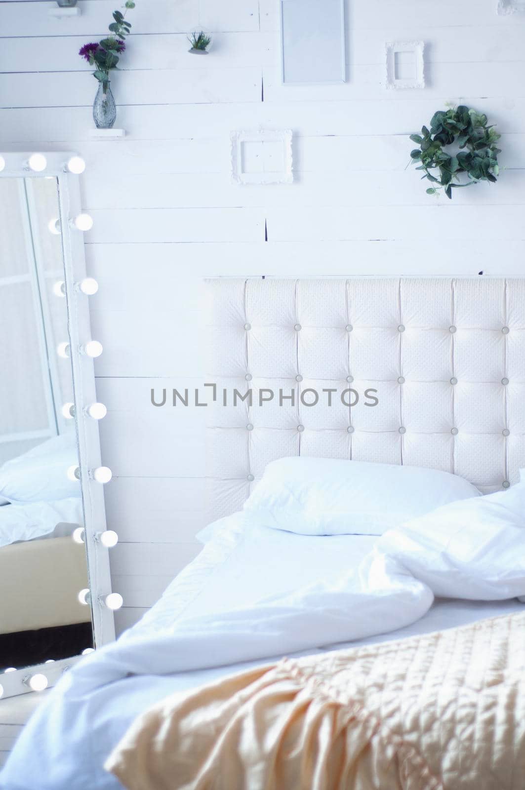 interior with bed spread out light retro with mirror