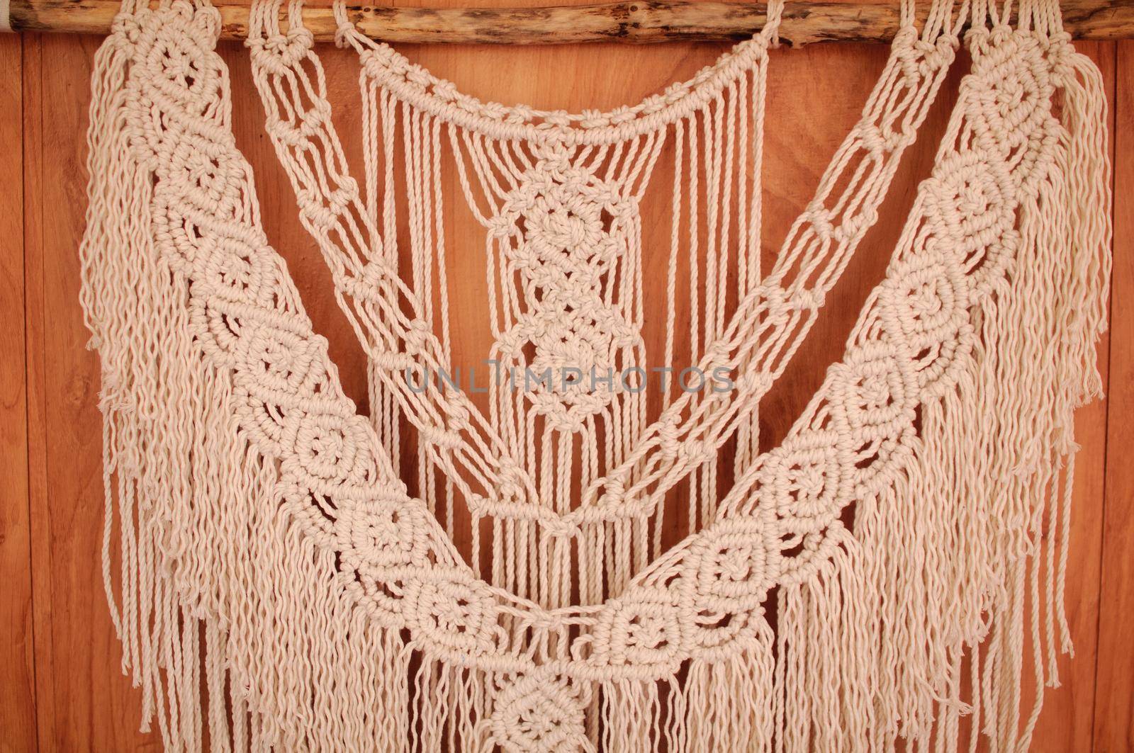 handmade macrame mural hanging on the wall