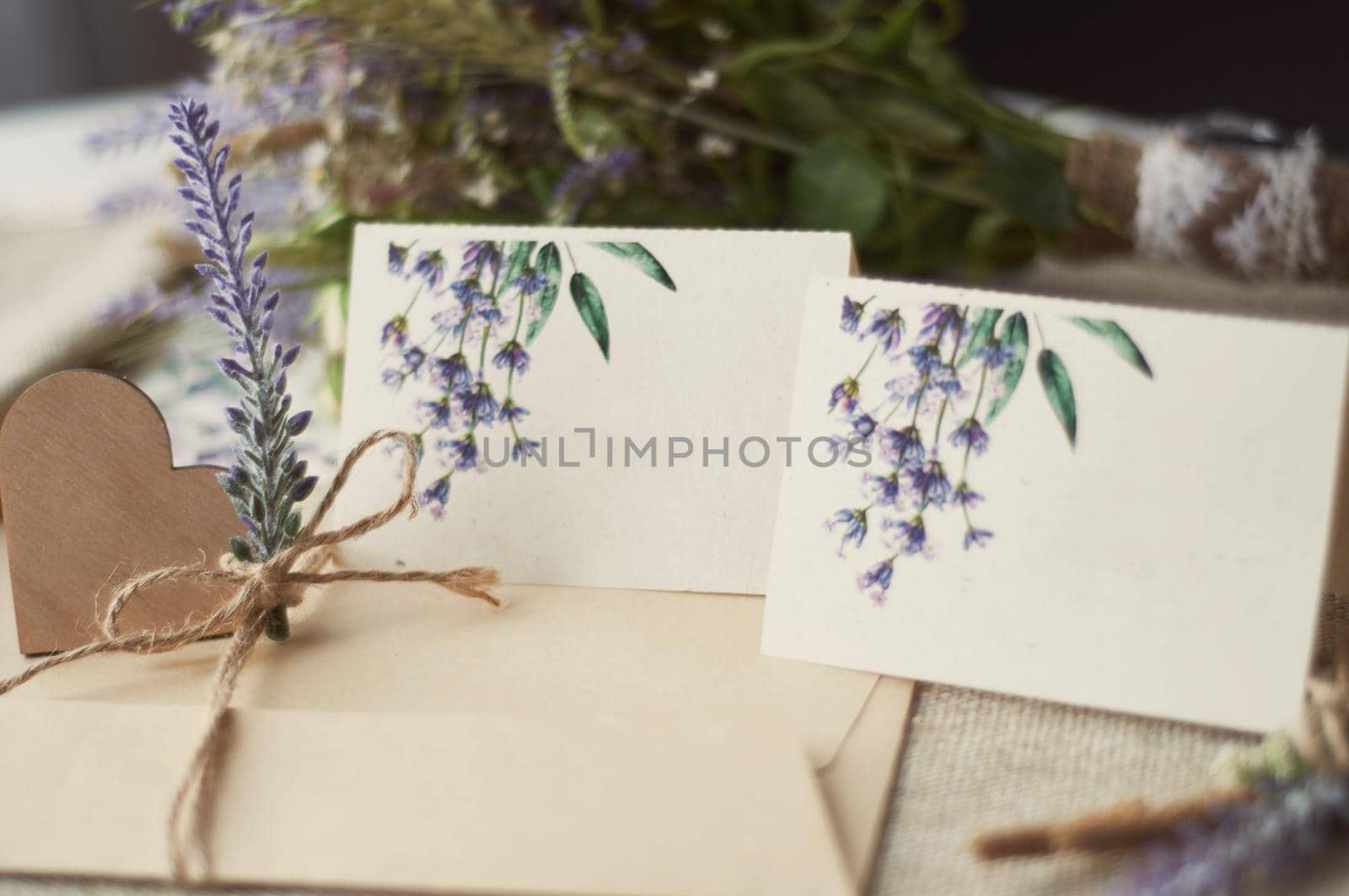 cards for lettering names blank, envelope on table with lavender flower