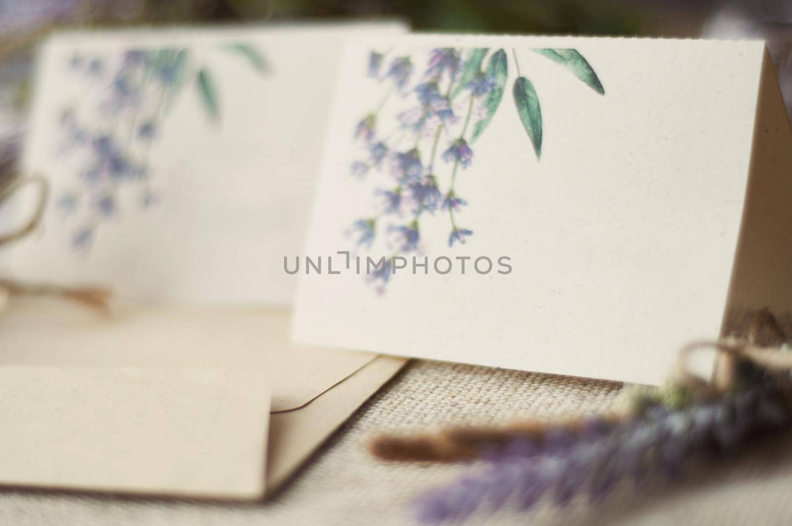 cards for lettering names blank, envelope on table with lavender flower