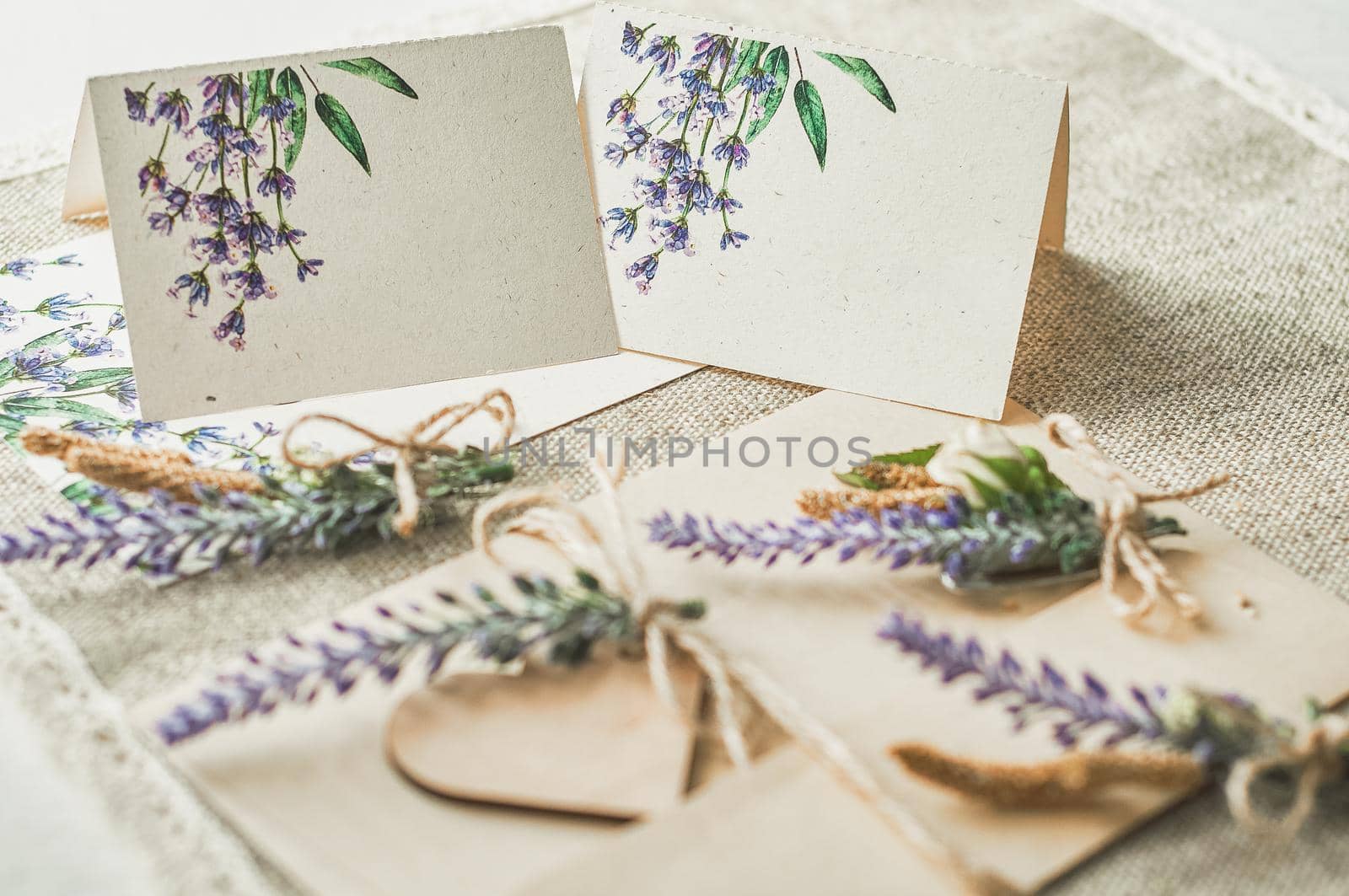 cards for lettering names blank, envelope on table with lavender flower