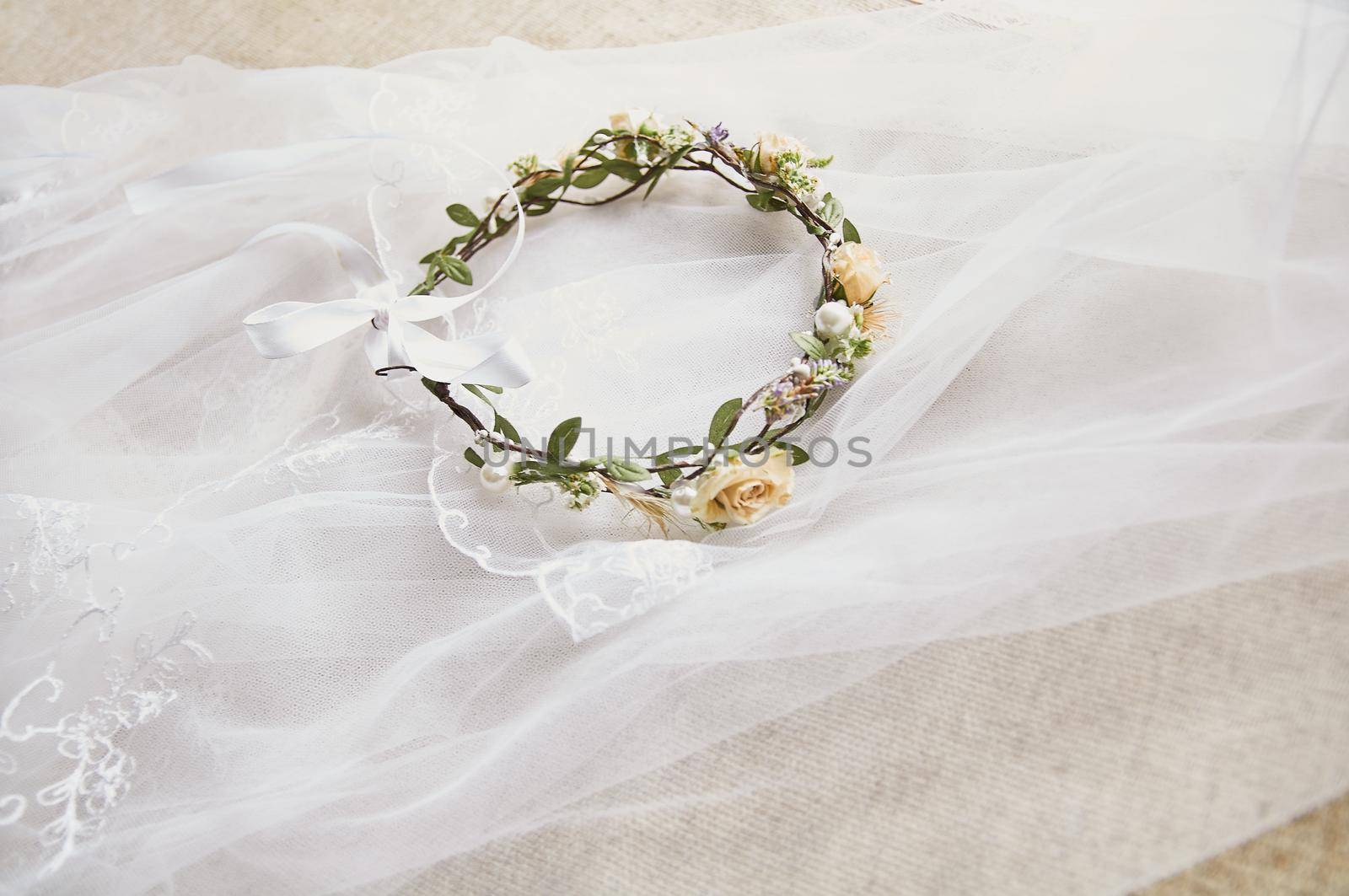 wedding wreath on table with lavender bridal bouquet by ozornina