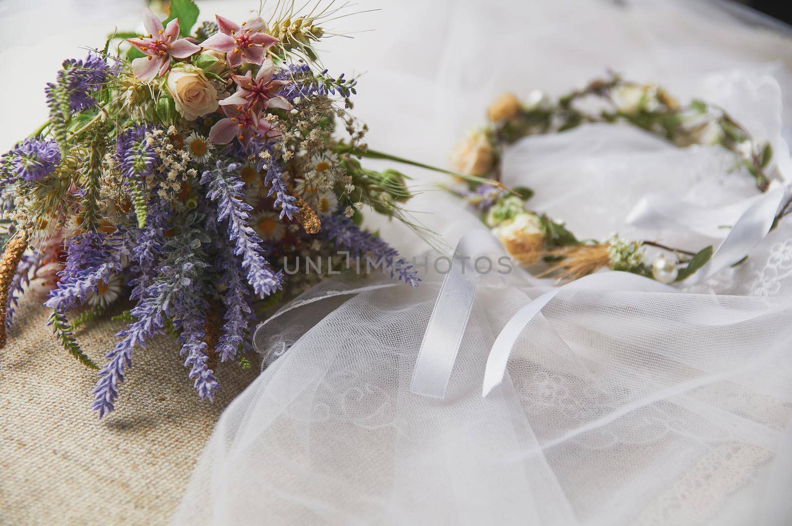 delicate wedding wreath in boho style on the table by ozornina
