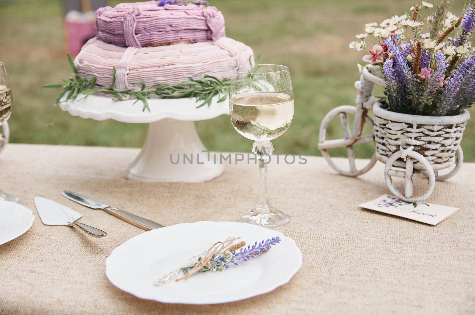 rustic style butter cake on a festive table with a glass of white wine