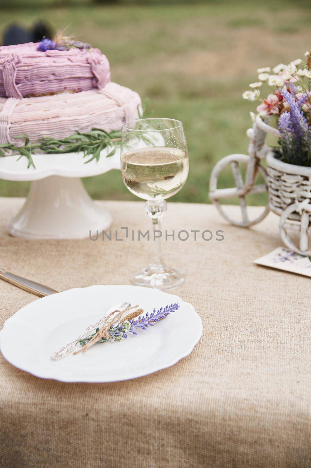 rustic style butter cake on a festive table with a glass  by ozornina