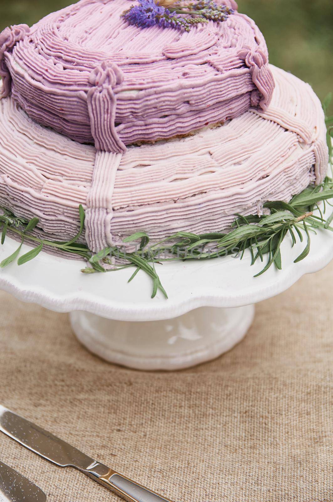 rustic style butter cake on a festive table with a glass  by ozornina