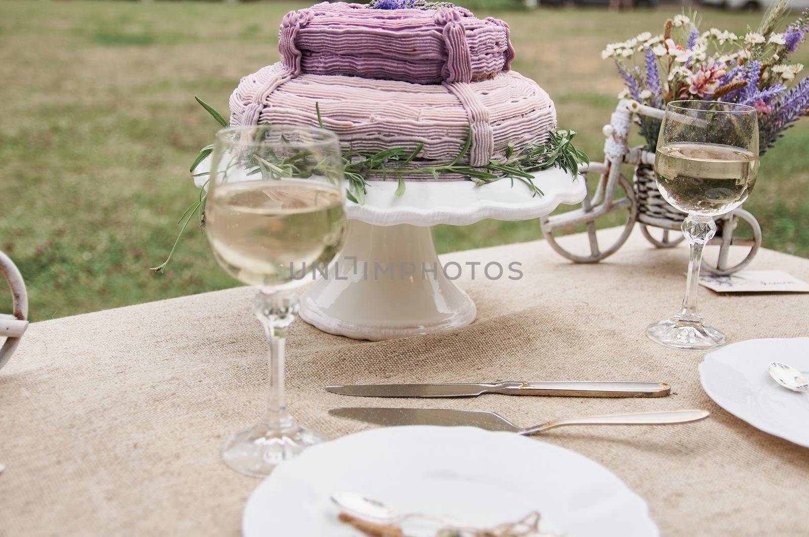 boho style wedding table with cake for bride and groom by ozornina