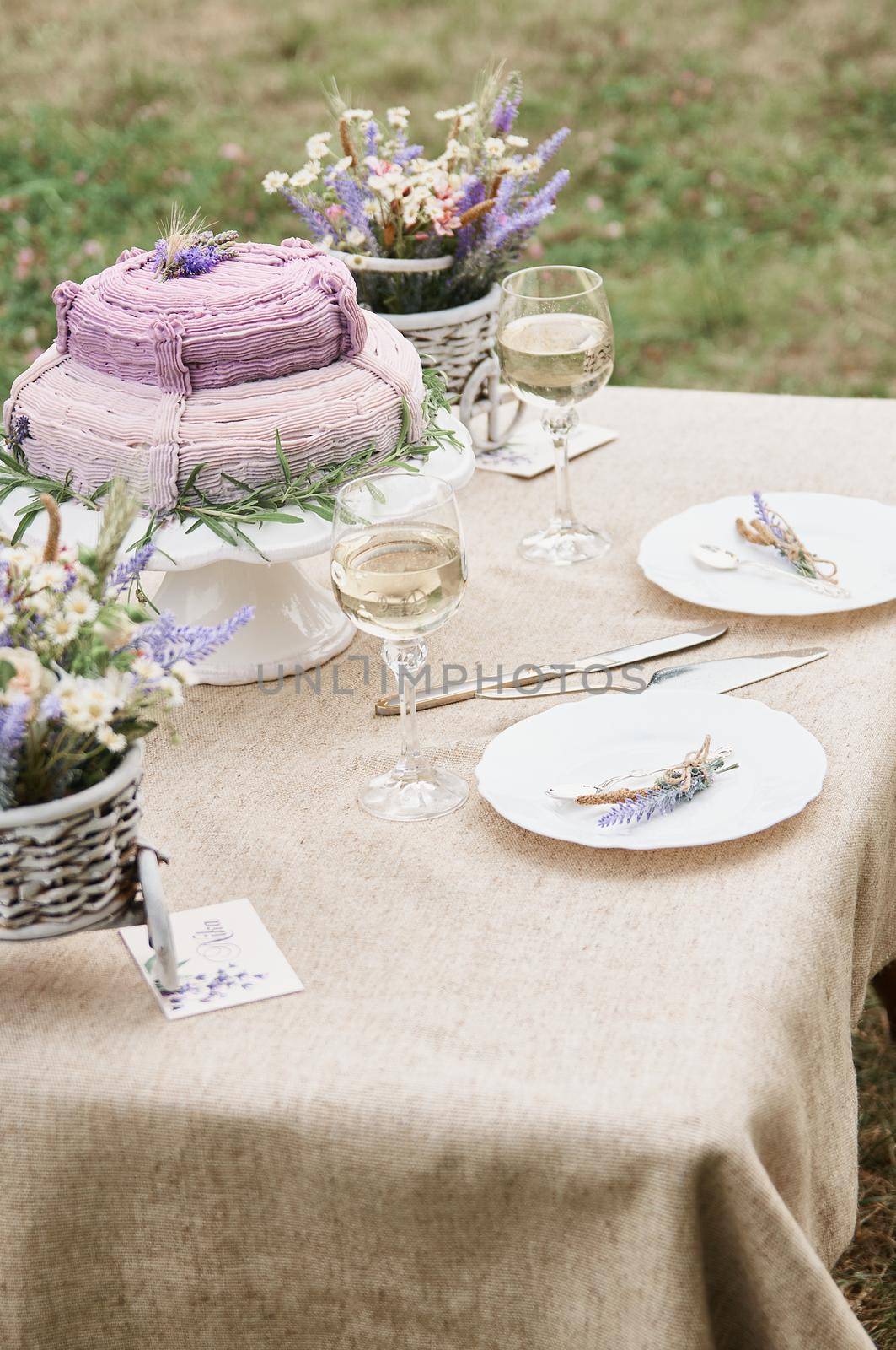 boho style wedding table with cake for bride and groom by ozornina