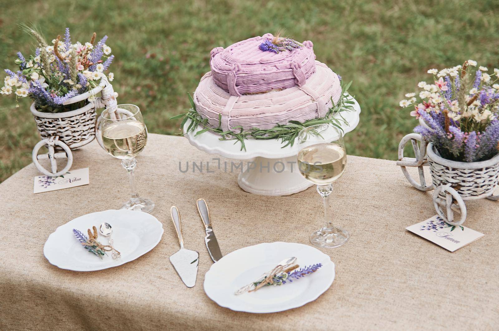 boho style wedding table with cake for bride and groom by ozornina