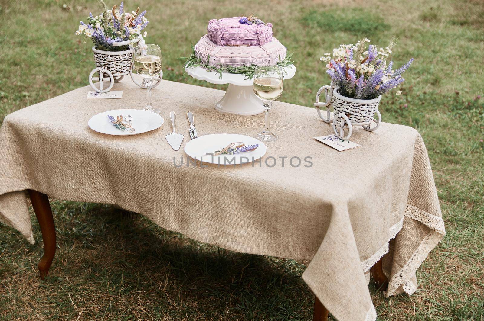 boho style wedding table with cake for bride and groom