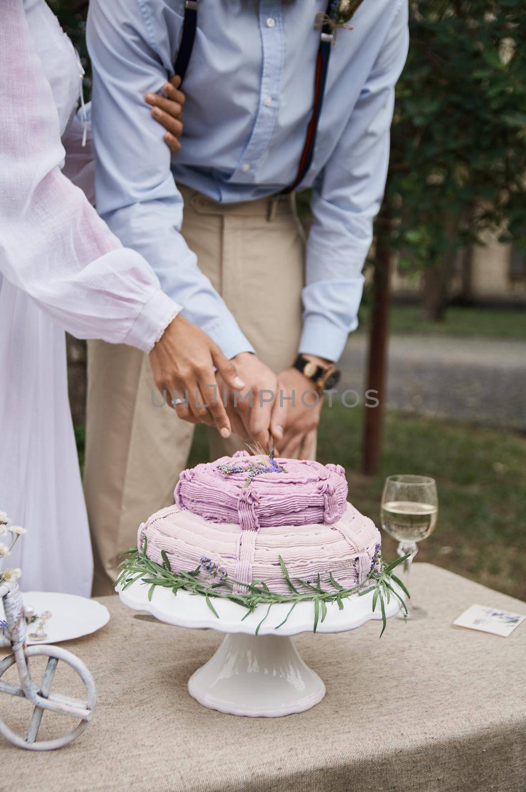 butter cake in rustic style on the holiday table cut the bride and groom