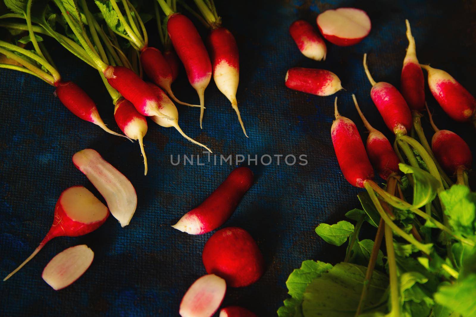 radish on a blue background laid out in groups