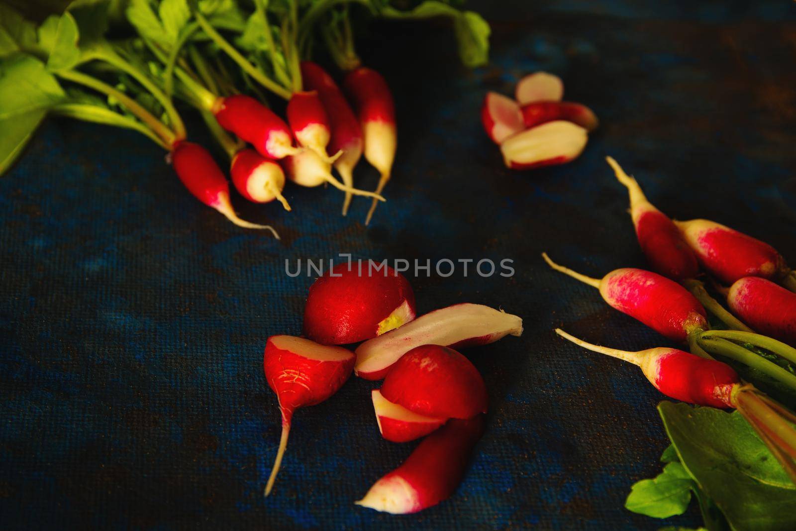 radish on a blue background laid out in groups