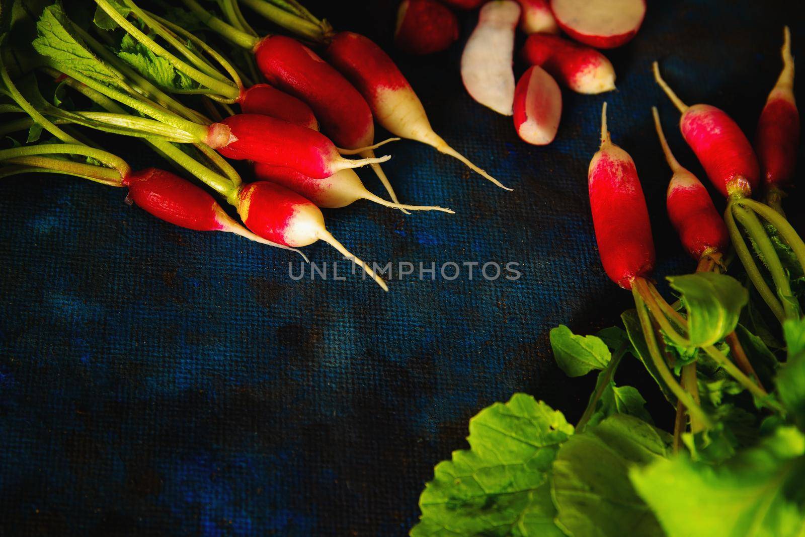 radish on a blue background laid out in groups