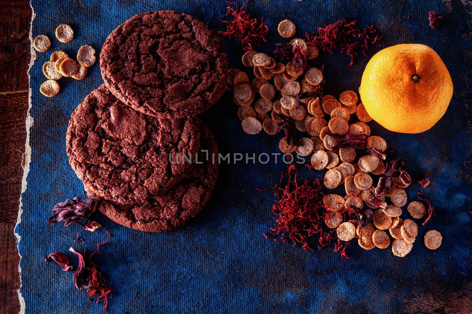 still life on a blue background with american dry crispy cookies and tangerines