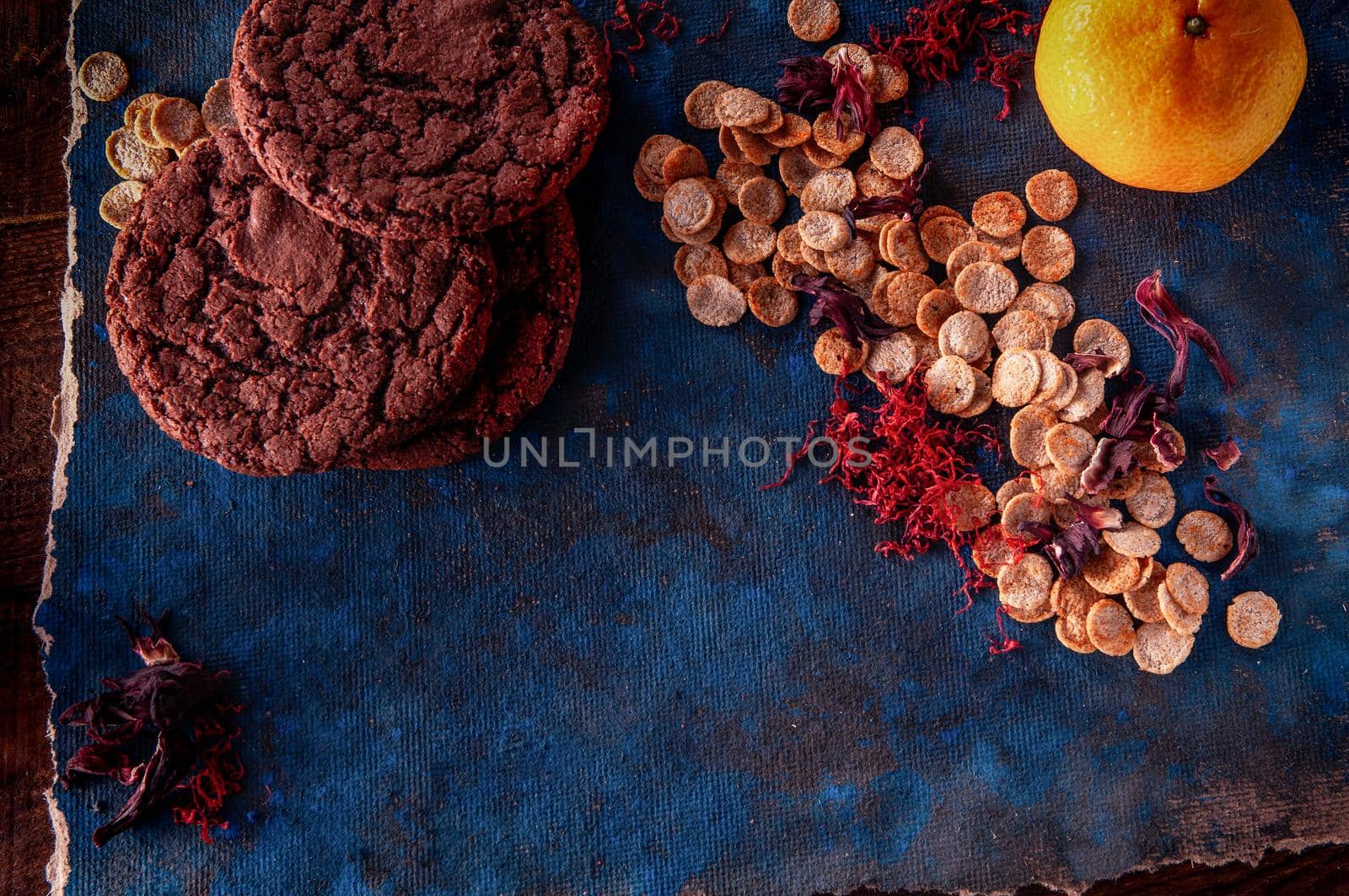 still life on a blue background with american dry crispy cookies and tangerines