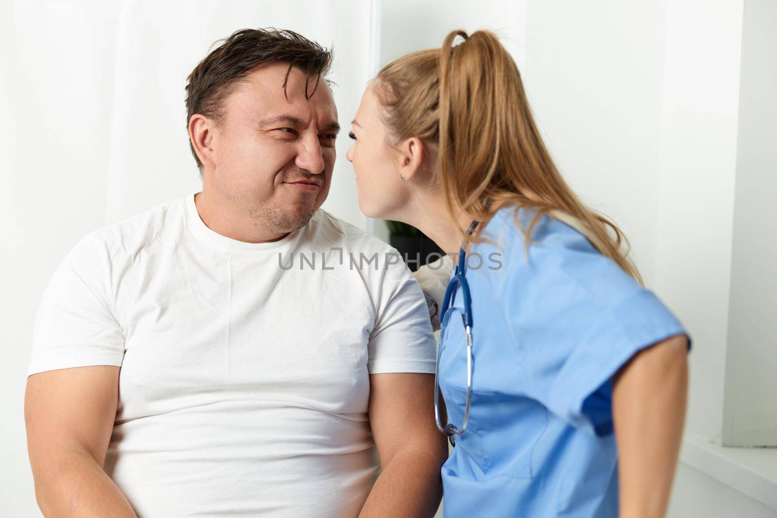 female doctor looking in the face patient emotion hospital. High quality photo