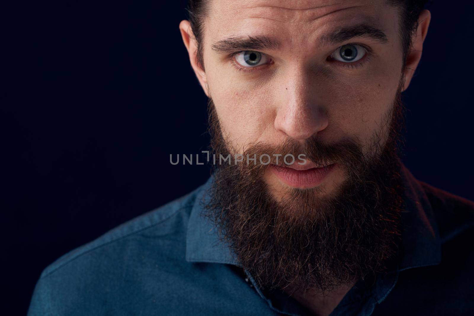 Cheerful man beard emotions black shirt close-up. High quality photo