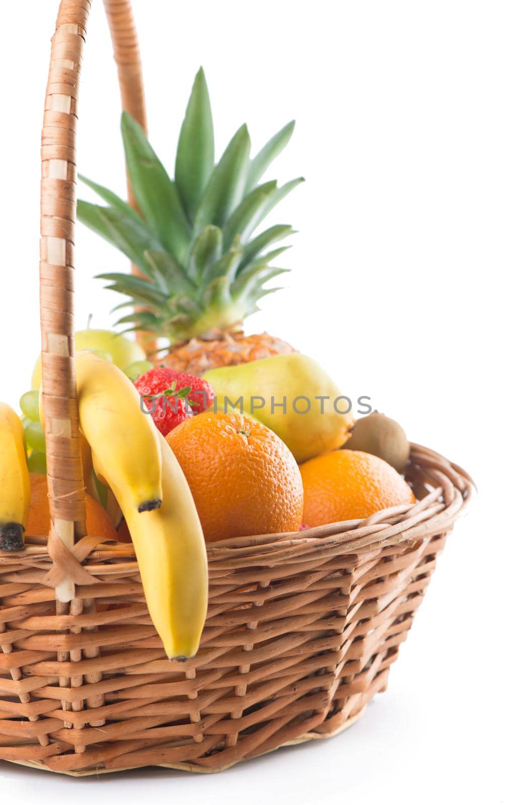 Fresh fruit in the basket against a white background