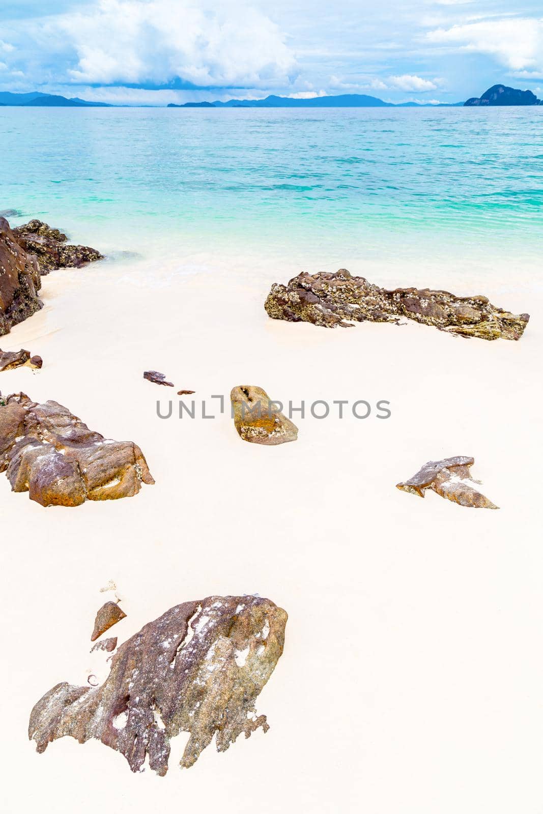 Wave of the sea on the sand beach at Similan islands, Thailand. by Gamjai