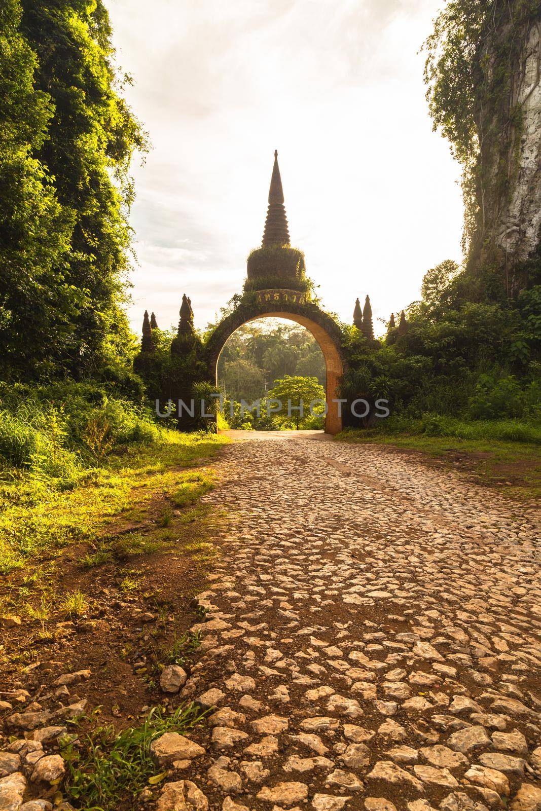 Temple gate at Khao Na Nai Luang Dharma Park in Surat Thani, Thailand. by Gamjai