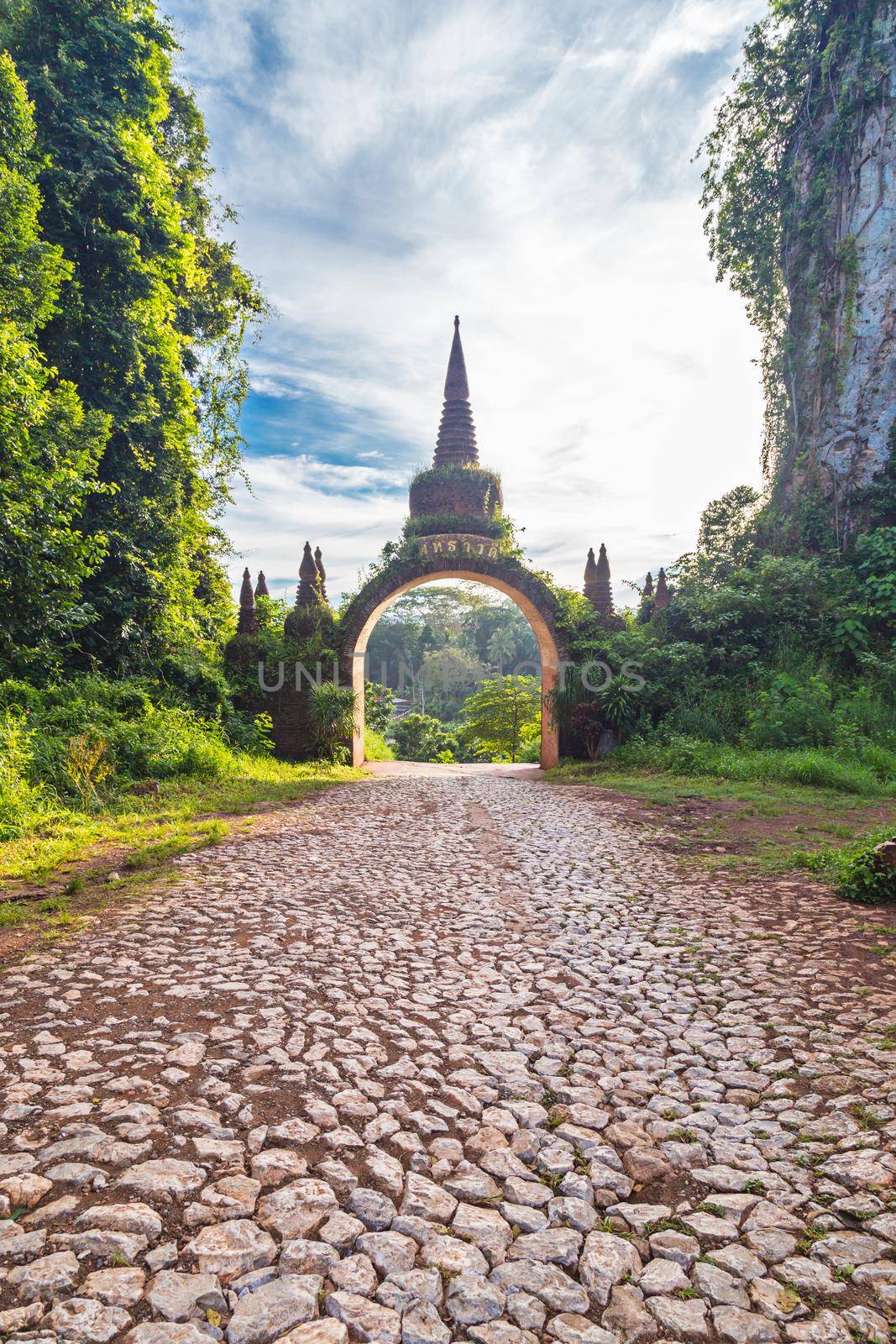 Temple gate at Khao Na Nai Luang Dharma Park in Surat Thani, Thailand. by Gamjai
