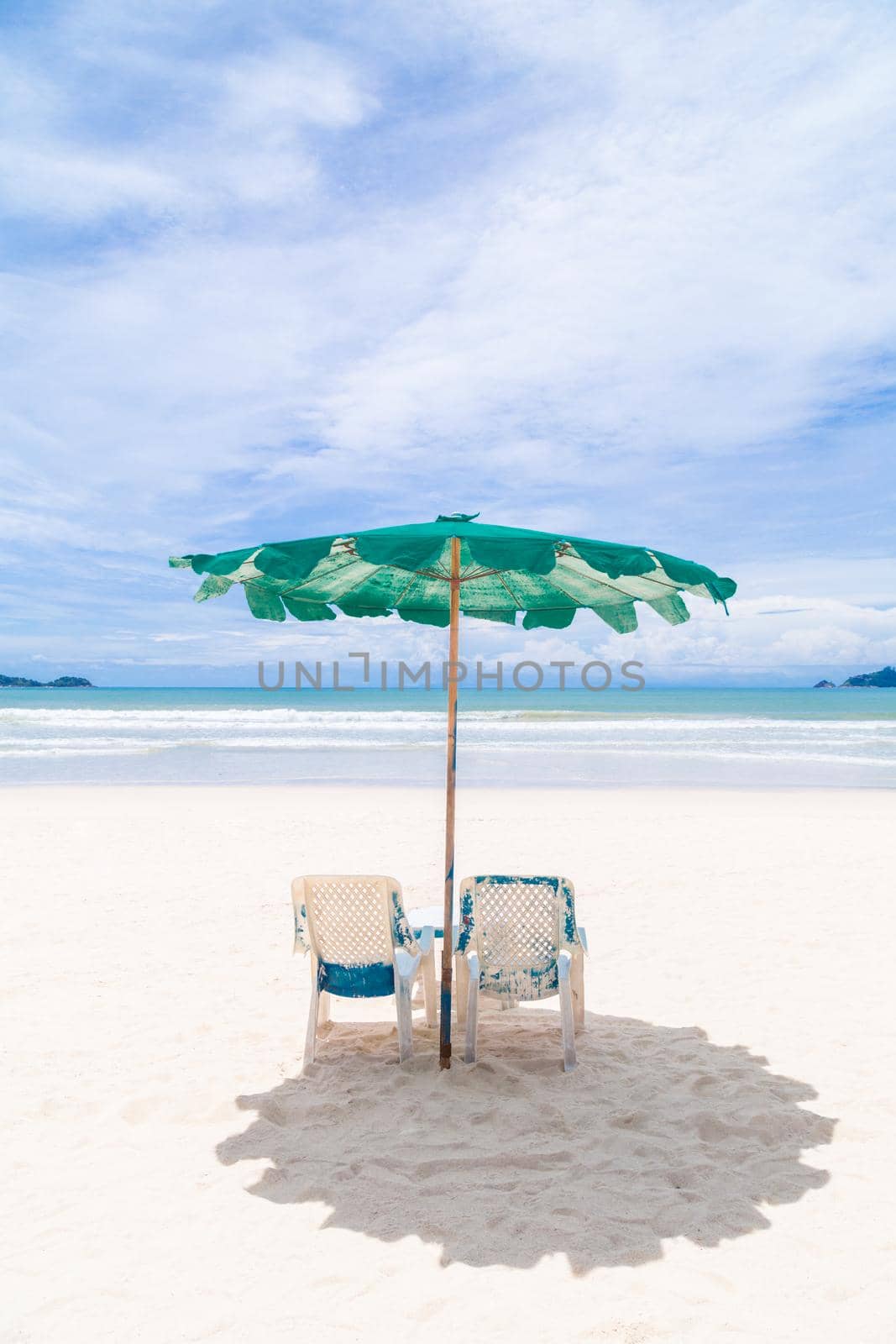 Chairs And Umbrella on the Beach - Tropical Holiday.