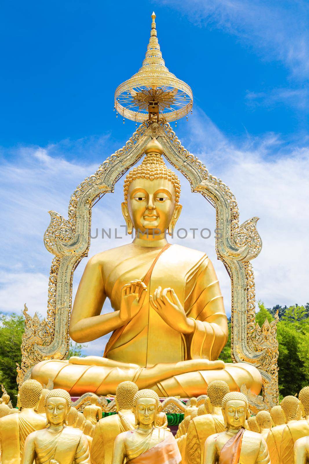 Row of disciple statues surrounding big buddha statue in public to the general public worship worship of Nakhon Nayok, Thailand.