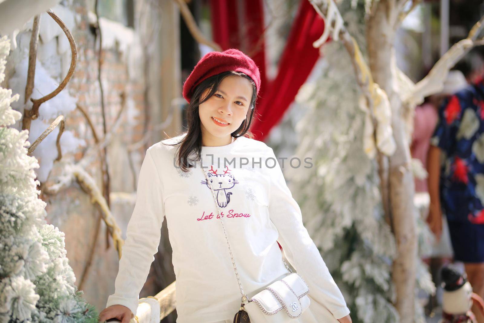 Young woman enjoying ride go around in the amusement park. by chuanchai