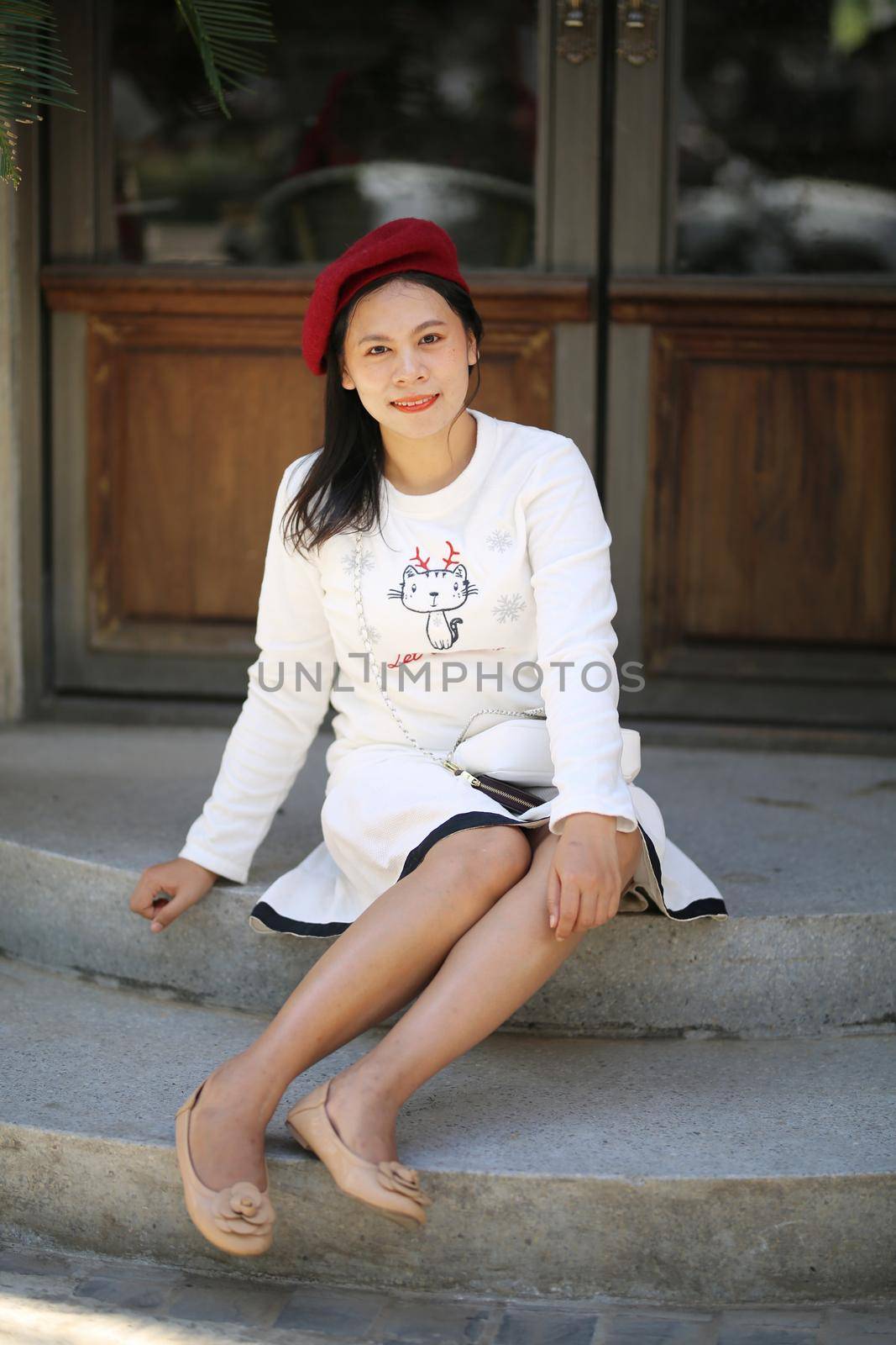 Young woman enjoying ride go around in the amusement park.