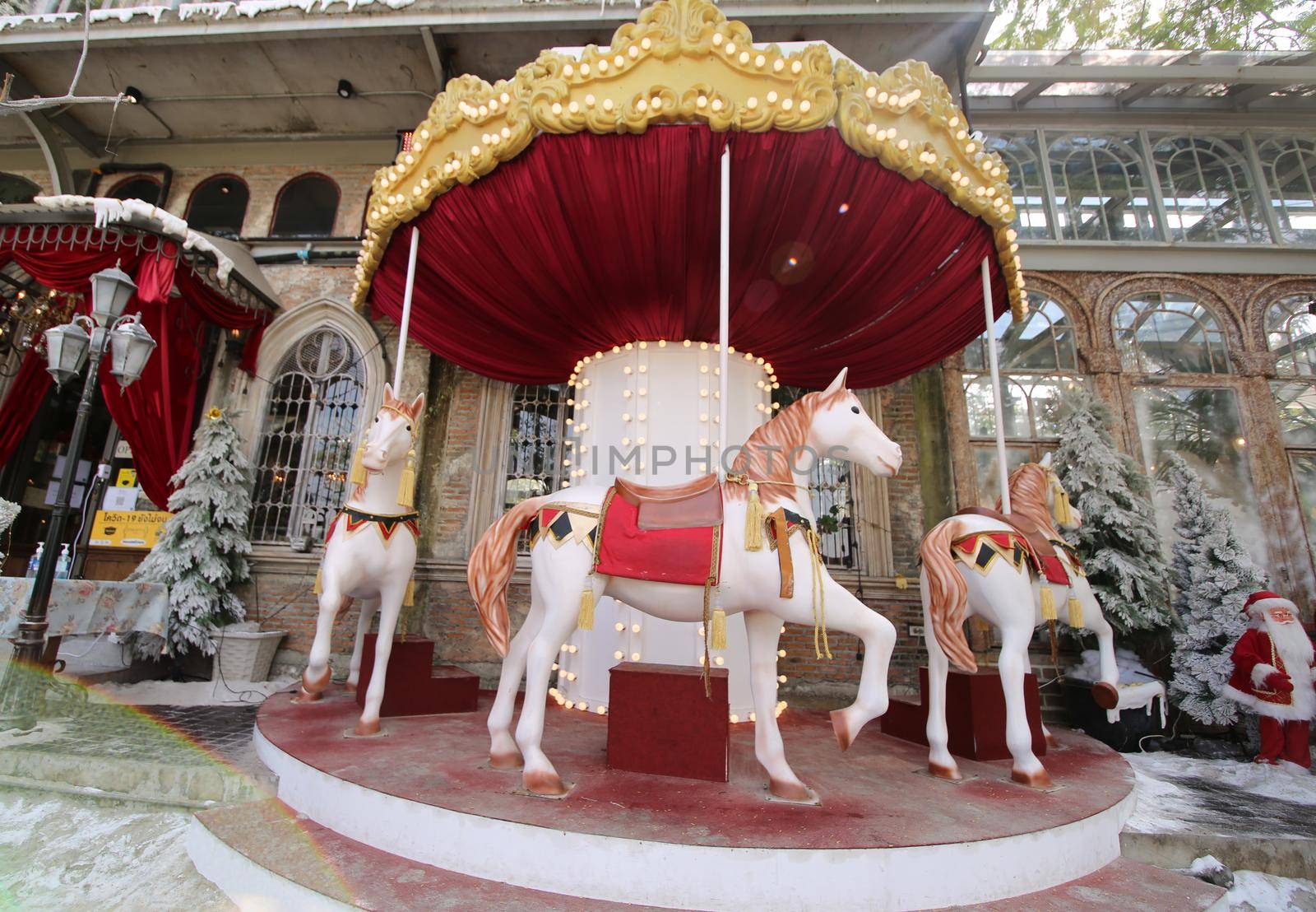 Horse ride turn around in the amusement park. by chuanchai