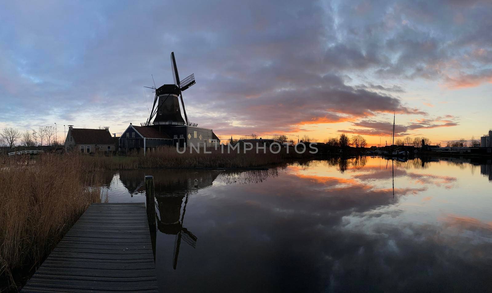 Windmill in IJlst during sunset in Friesland The Netherlands