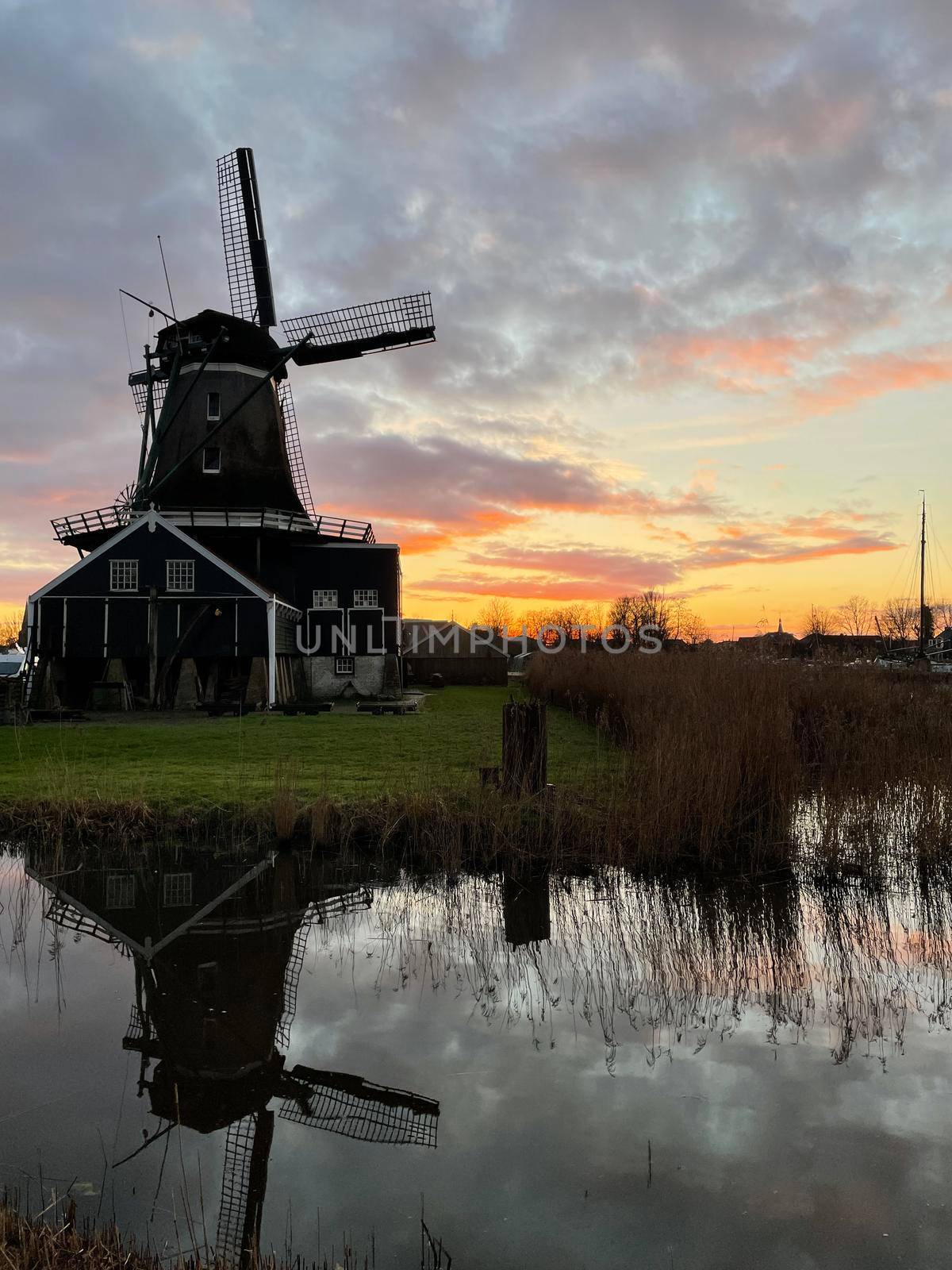 Windmill in IJlst during sunset in Friesland The Netherlands