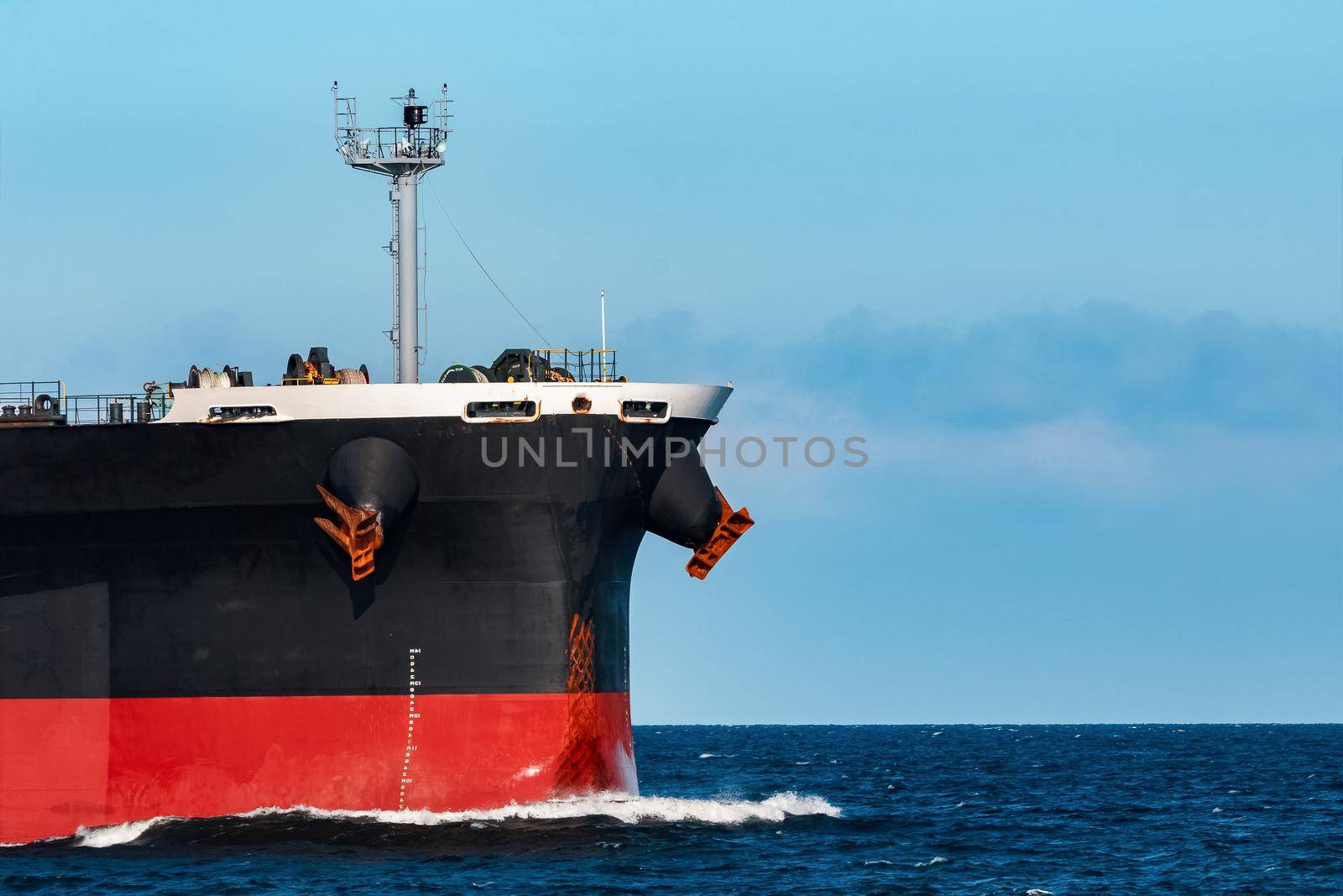 Black bulker ship. Logistics and merchandise transportations