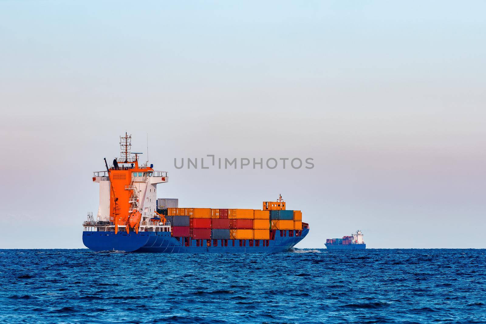 Blue container ship. Global logistics and merchandise transfer