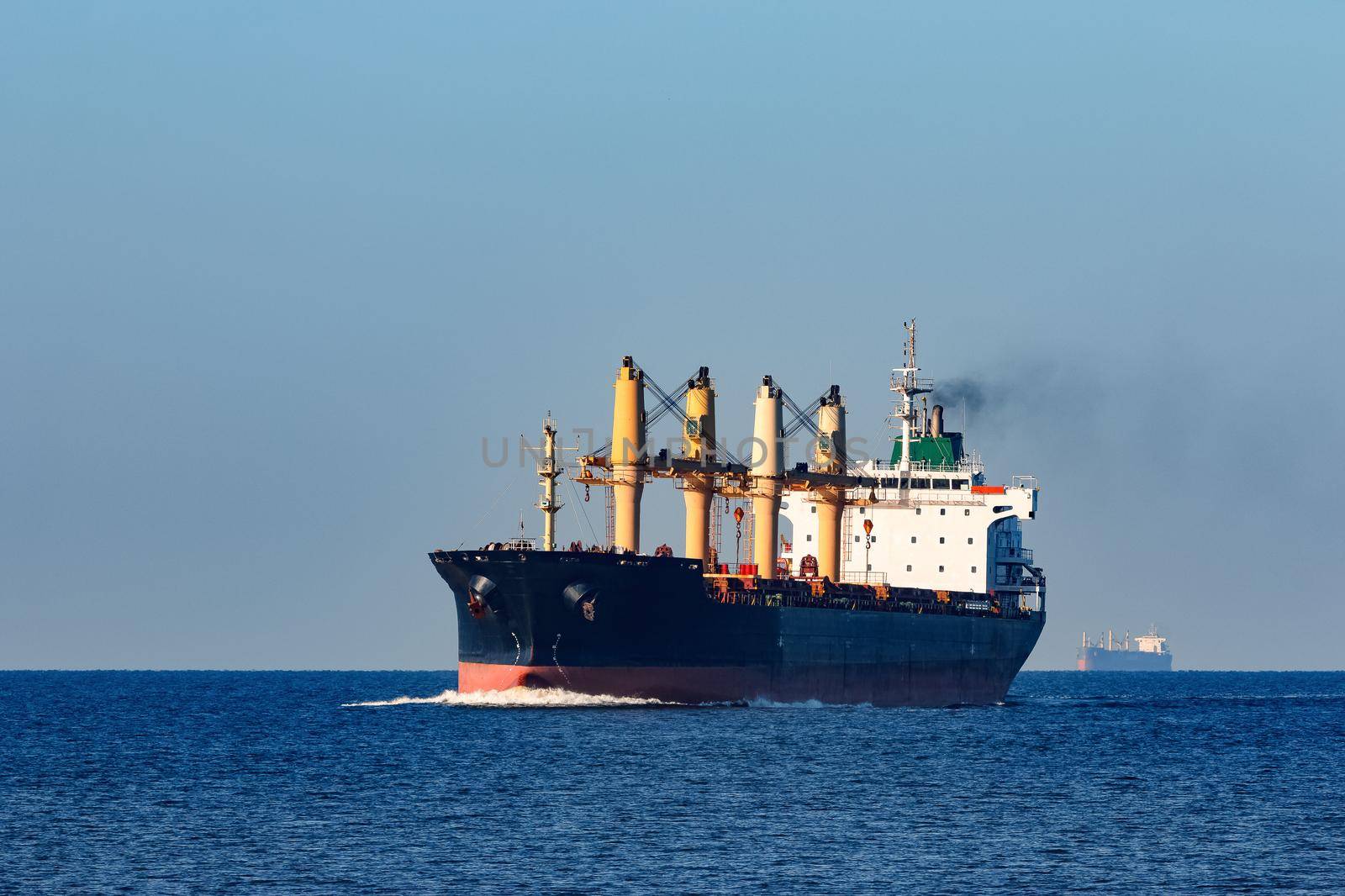 Black cargo ship sailing from the Baltic sea