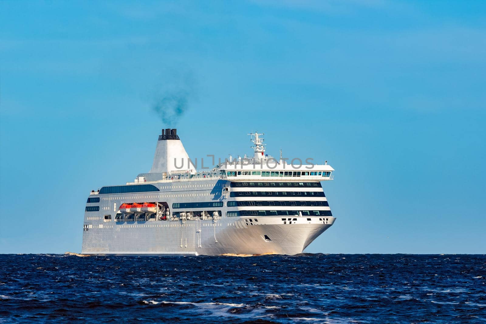 White cruise liner sailing on a clear day