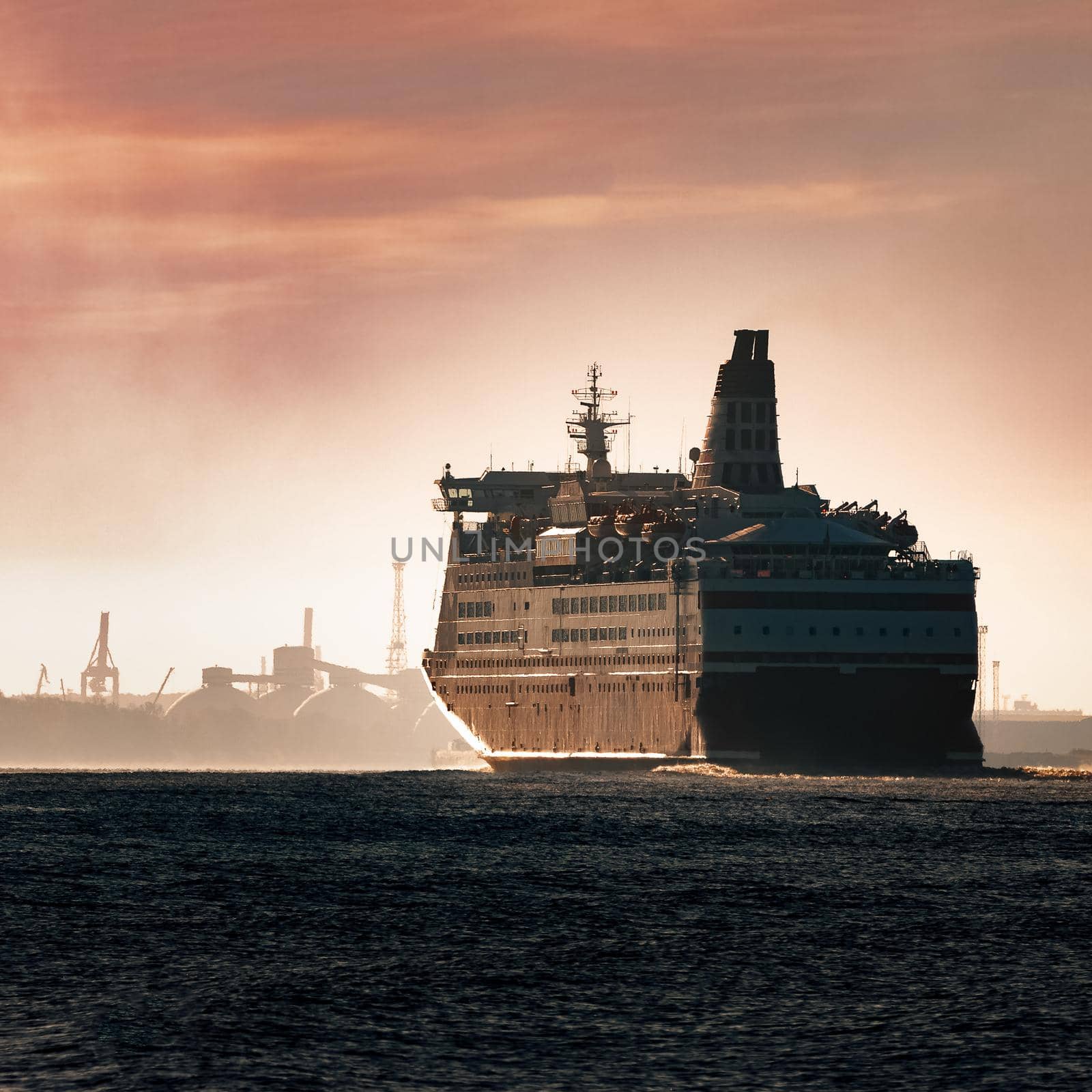 Big cruise liner. Passenger ferry ship entering Riga at morning