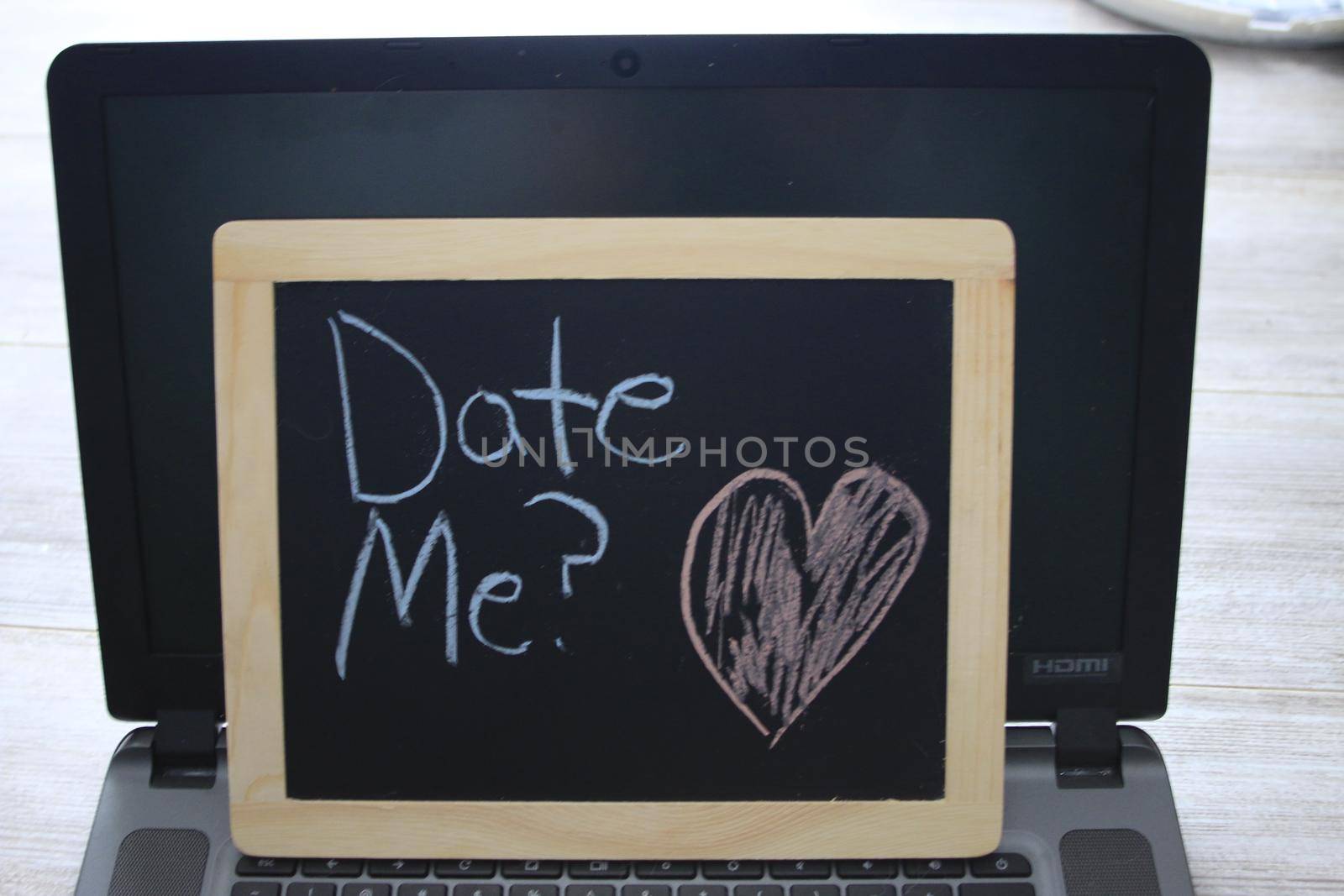 date me wrote on a black chalkboard . High quality photo
