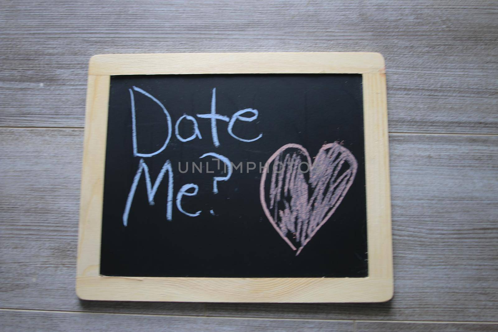 date me wrote on a black chalkboard  by mynewturtle1